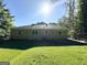 The backyard offers ample space and is surrounded by mature trees at 2469 Baywood Se Dr, Atlanta, GA 30315