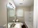Clean bathroom with a tub and shower, and updated vanity at 2469 Baywood Se Dr, Atlanta, GA 30315