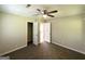 Cozy bedroom with plush carpet, ceiling fan, and convenient closet space at 2469 Baywood Se Dr, Atlanta, GA 30315