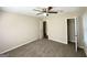 The bedroom features a lighted ceiling fan, carpet, and a closet for storage at 2469 Baywood Se Dr, Atlanta, GA 30315