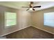 This bedroom features neutral walls, carpet, and a ceiling fan with light at 2469 Baywood Se Dr, Atlanta, GA 30315