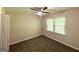 The bedroom has carpet, neutral walls and a ceiling fan with light fixture at 2469 Baywood Se Dr, Atlanta, GA 30315