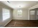 Sunlit dining area featuring hardwood floors and stylish lighting at 2469 Baywood Se Dr, Atlanta, GA 30315