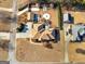 An aerial view showcases the property's manicured lawn, mature trees, and outdoor living spaces including a patio and fire pit at 200 Magnolia Ct, Mcdonough, GA 30252