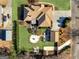 Aerial view of a home with an expansive yard, outdoor living spaces, mature trees, and a long driveway at 200 Magnolia Ct, Mcdonough, GA 30252
