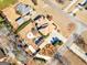 Beautiful aerial of house with spacious yard, fire pit, mature trees, and proximity to other homes in the neighborhood at 200 Magnolia Ct, Mcdonough, GA 30252