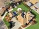 Aerial view of a home with a beautiful backyard including a fire pit and outdoor kitchen at 200 Magnolia Ct, Mcdonough, GA 30252