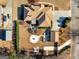 An aerial view reveals the property's layout including a spacious yard, patio, fire pit, and convenient access to streets at 200 Magnolia Ct, Mcdonough, GA 30252