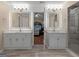 Modern bathroom featuring double vanities and framed mirrors with contemporary lighting at 200 Magnolia Ct, Mcdonough, GA 30252