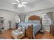 Serene main bedroom with hardwood floors, ceiling fan, and decorative touches at 200 Magnolia Ct, Mcdonough, GA 30252