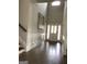 Bright foyer features hardwood floors, a soaring ceiling and decorative wall molding at 160 Elysian Dr, Fayetteville, GA 30214