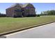 Beautiful two story brick home with manicured lawn and professional landscaping at 160 Elysian Dr, Fayetteville, GA 30214