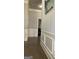 Hallway featuring attractive trim and hardwood floors at 160 Elysian Dr, Fayetteville, GA 30214