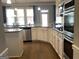 Bright kitchen boasts granite countertops, a gas range, and modern cabinets at 160 Elysian Dr, Fayetteville, GA 30214