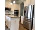 Open kitchen features granite countertops and stainless steel appliances at 160 Elysian Dr, Fayetteville, GA 30214