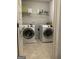 Bright laundry room featuring side-by-side washer and dryer at 160 Elysian Dr, Fayetteville, GA 30214