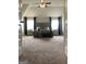 This spacious main bedroom features a tray ceiling, neutral carpeting, and elegant furnishings at 160 Elysian Dr, Fayetteville, GA 30214