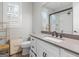 Bright bathroom featuring a quartz vanity, modern fixtures, and glass enclosed shower at 319 S Mount Carmel Rd, Mcdonough, GA 30253