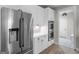 Kitchen with stainless steel appliances, white cabinetry, double oven, and patterned flooring at 319 S Mount Carmel Rd, Mcdonough, GA 30253
