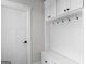 Bright mudroom featuring an organizer, coat hooks, and a white door at 319 S Mount Carmel Rd, Mcdonough, GA 30253