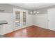Dining area with hardwood floors, beadboard accent wall, and stylish chandelier at 1190 N Ola Rd, Mcdonough, GA 30252