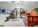 Spacious bedroom featuring a sloped ceiling, carpet, and a play area at 161 Mills Dr, Covington, GA 30016