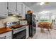 Well-lit kitchen features stainless steel appliances, and an eat-in breakfast area with great natural light at 161 Mills Dr, Covington, GA 30016