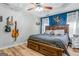 Comfortable main bedroom features a tray ceiling and a stylish accent wall at 161 Mills Dr, Covington, GA 30016