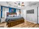 Spacious main bedroom boasts a tray ceiling, accent wall, and ensuite bathroom at 161 Mills Dr, Covington, GA 30016