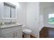 Bathroom featuring a white vanity with marble countertops and a tiled floor at 1993 Reynolds Sw Dr, Atlanta, GA 30315