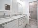 Bathroom featuring marble countertop, double vanity, white cabinetry, and tiled flooring at 1993 Reynolds Sw Dr, Atlanta, GA 30315