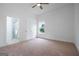 Bedroom with carpet, ceiling fan, and adjacent bathroom with glass shower doors at 1993 Reynolds Sw Dr, Atlanta, GA 30315