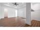 Bright, spacious bedroom featuring hardwood floors, tray ceiling, and access to a walk-in closet at 1993 Reynolds Sw Dr, Atlanta, GA 30315