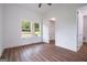 Empty bedroom with window, white trim, and wood floors at 1993 Reynolds Sw Dr, Atlanta, GA 30315