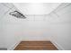 Walk-in closet with wood floors and metal shelving at 1993 Reynolds Sw Dr, Atlanta, GA 30315
