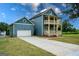 New construction featuring a long driveway, well-manicured lawn and an attached garage at 1993 Reynolds Sw Dr, Atlanta, GA 30315