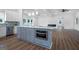 Spacious kitchen with island, stainless steel appliances, undermount microwave and open layout to living area at 1993 Reynolds Sw Dr, Atlanta, GA 30315