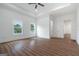 Bright main bedroom featuring hardwood floors, recessed lighting, and large windows at 1993 Reynolds Sw Dr, Atlanta, GA 30315