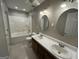 This bathroom features a double vanity, a tub, a shower, and linoleum flooring at 5761 Hancock Dr, Social Circle, GA 30025