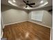 Bedroom featuring hardwood floors and a ceiling fan at 5761 Hancock Dr, Social Circle, GA 30025