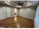 Bedroom with hardwood flooring and a view to the bathroom at 5761 Hancock Dr, Social Circle, GA 30025