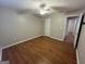 Bedroom featuring hardwood floors, neutral walls, and a ceiling fan with no window at 5761 Hancock Dr, Social Circle, GA 30025