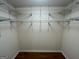Walk in closet with wire shelving and hardwood floor at 5761 Hancock Dr, Social Circle, GA 30025
