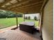 Exterior deck area featuring a relaxing hot tub and serene backyard at 5761 Hancock Dr, Social Circle, GA 30025