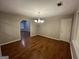 Dining room featuring wood floors and chandelier lighting at 5761 Hancock Dr, Social Circle, GA 30025