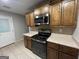 Kitchen featuring stainless steel microwave and range at 5761 Hancock Dr, Social Circle, GA 30025