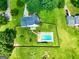 Aerial view of house with pool and large fenced in backyard at 125 Drennan Dr, Fayetteville, GA 30215