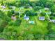 Aerial view of house with pool on large lot with neighbors at 125 Drennan Dr, Fayetteville, GA 30215