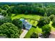 Aerial view of house with pool and 2 car garage on large lot at 125 Drennan Dr, Fayetteville, GA 30215