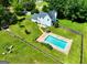 Aerial view of house and pool on large well manicured lot at 125 Drennan Dr, Fayetteville, GA 30215